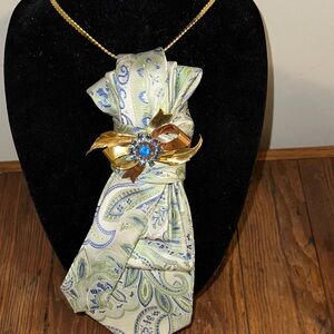 Paisley Necktie with Gold and Blue Brooch